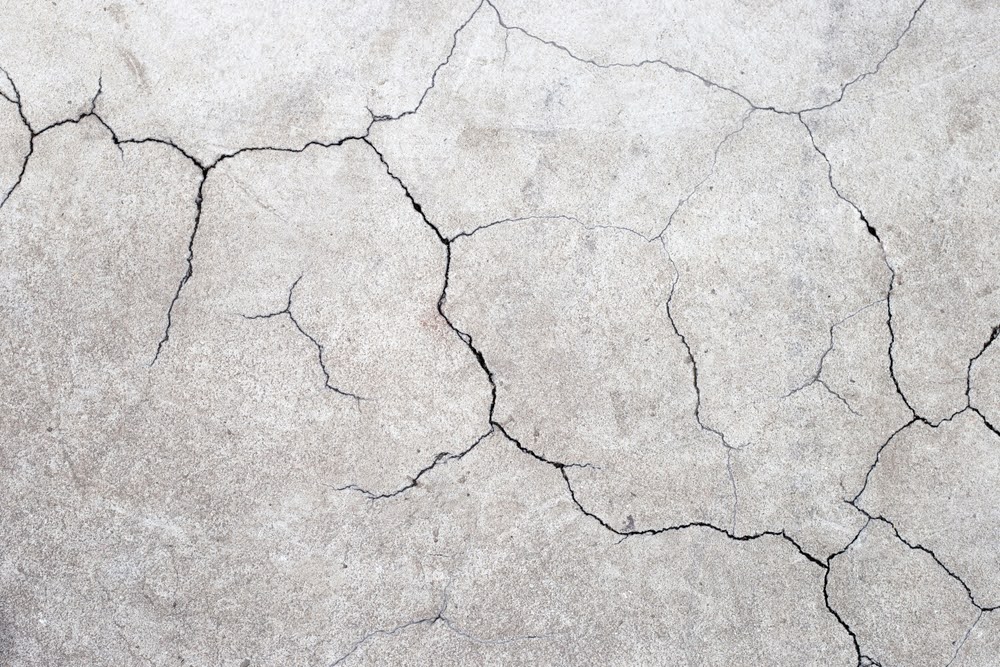 cracked cement or concrete surface texture